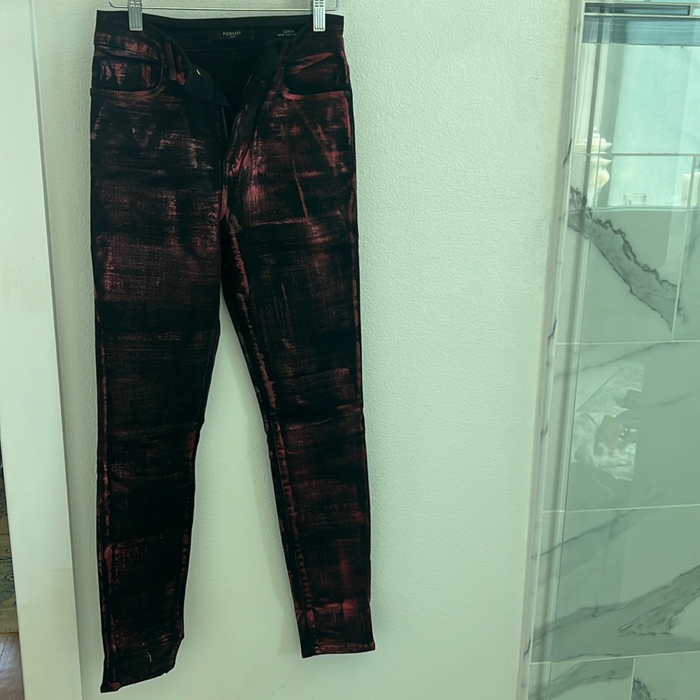 Red and black coated denim jeans